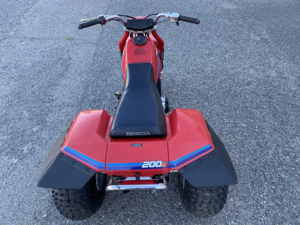Discover the ATC200S, Honda’s versatile sport-utility 3-wheeler featuring a 182cc 4-stroke engine, 5-speed auto-clutch transmission, and trail-ready design.
