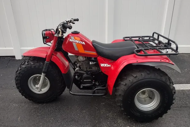 Discover the ATC200M, Honda’s compact utility 3-wheeler featuring a 182cc 4-stroke engine, 5-speed auto-clutch transmission, and rugged design.