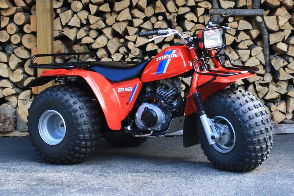 Discover the ATC200ES Big Red, Honda’s iconic utility 3-wheeler featuring electric start, 182cc 4-stroke engine, and rugged farm-ready design.