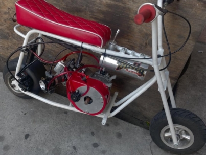 The dark red stock minibike blends deep, rich color styling with reliable factory performance. Explore engine specs, ride quality, durability